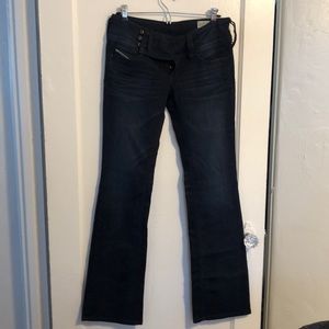 Dark wash blue denim five pocket jeans